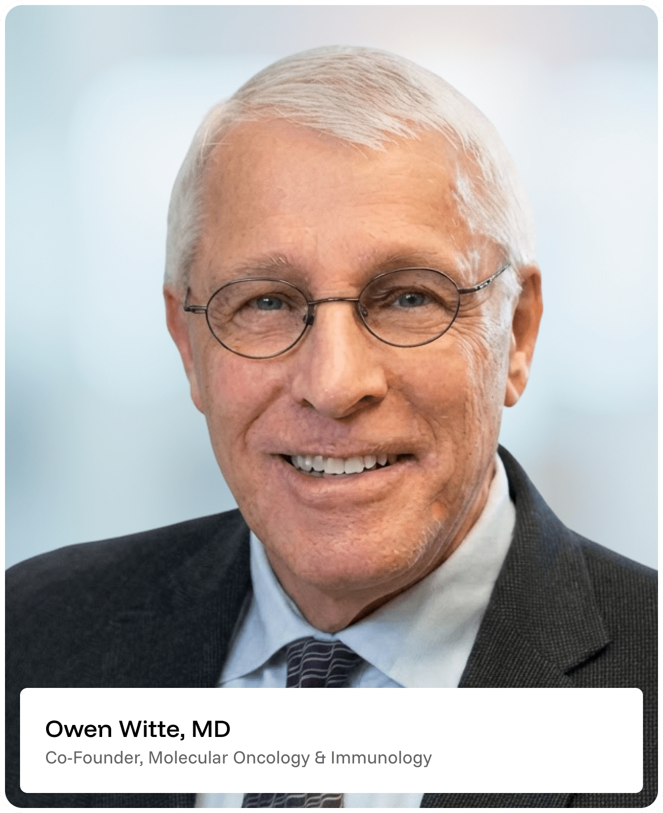 Smiling older man with short gray hair and glasses, wearing a dark suit jacket, light blue shirt, and striped tie. Text below reads: Owen Witte, MD, Co-Founder, Molecular Oncology & Immunology..
