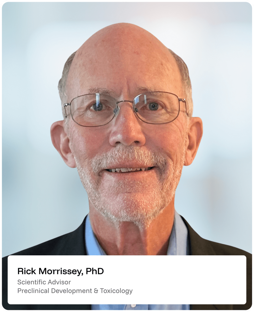 Portrait of an older man with glasses, a trimmed white beard, and a bald head, wearing a dark blazer and light blue shirt. Label at bottom reads: Rick Morrissey, PhD, Scientific Advisor, Preclinical Development & Toxicology..